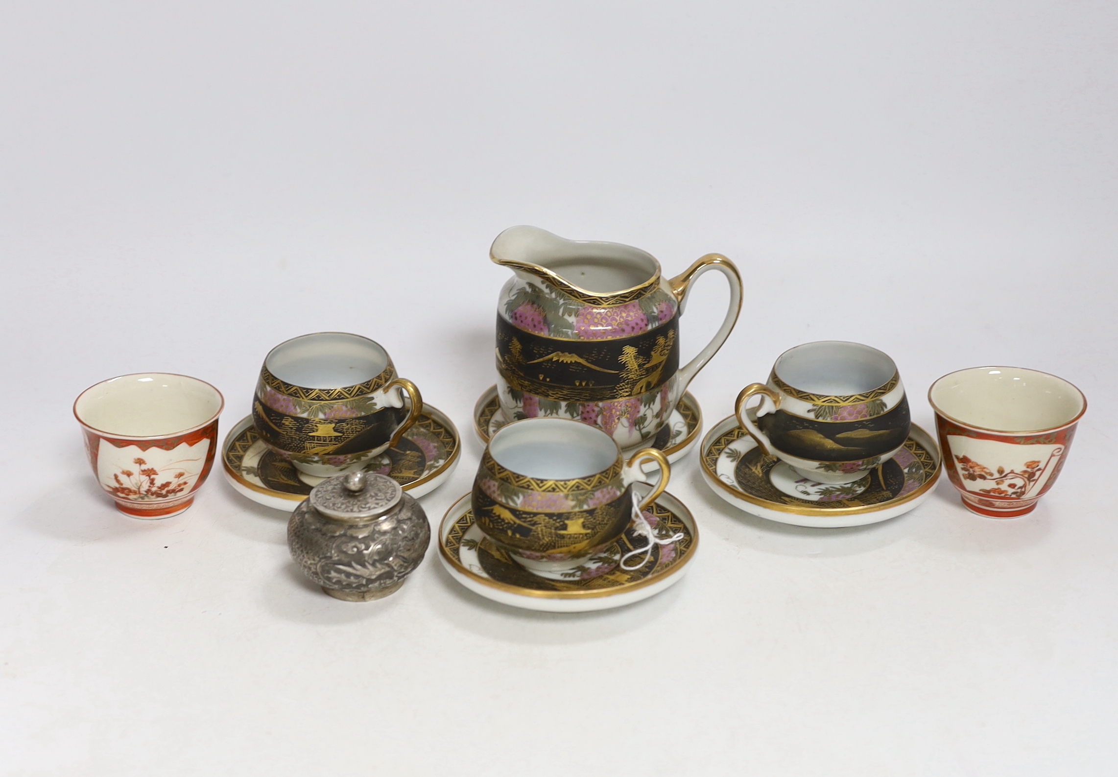 A Chinese white metal unsigned pot and cover, 5cm high, together with two Japanese Kutani tea bowls, 19th century and a Japanese egg shell part tea set